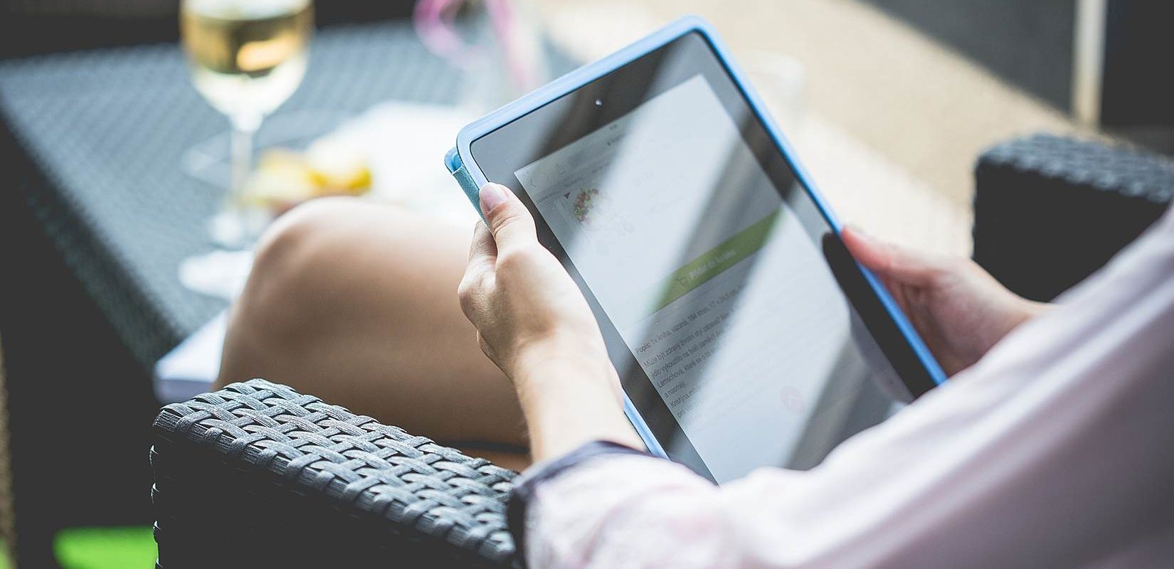 Girl using Tablet on the Garden